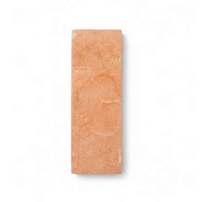 Matte terracotta 2x6 tile sample by Clay Imports, featuring a sandy texture and subtle swirling patterns on a white background.