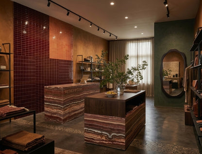 Oxblood 2x6 clay tile from Clay Imports, part of a tiled wall design in a retail store.