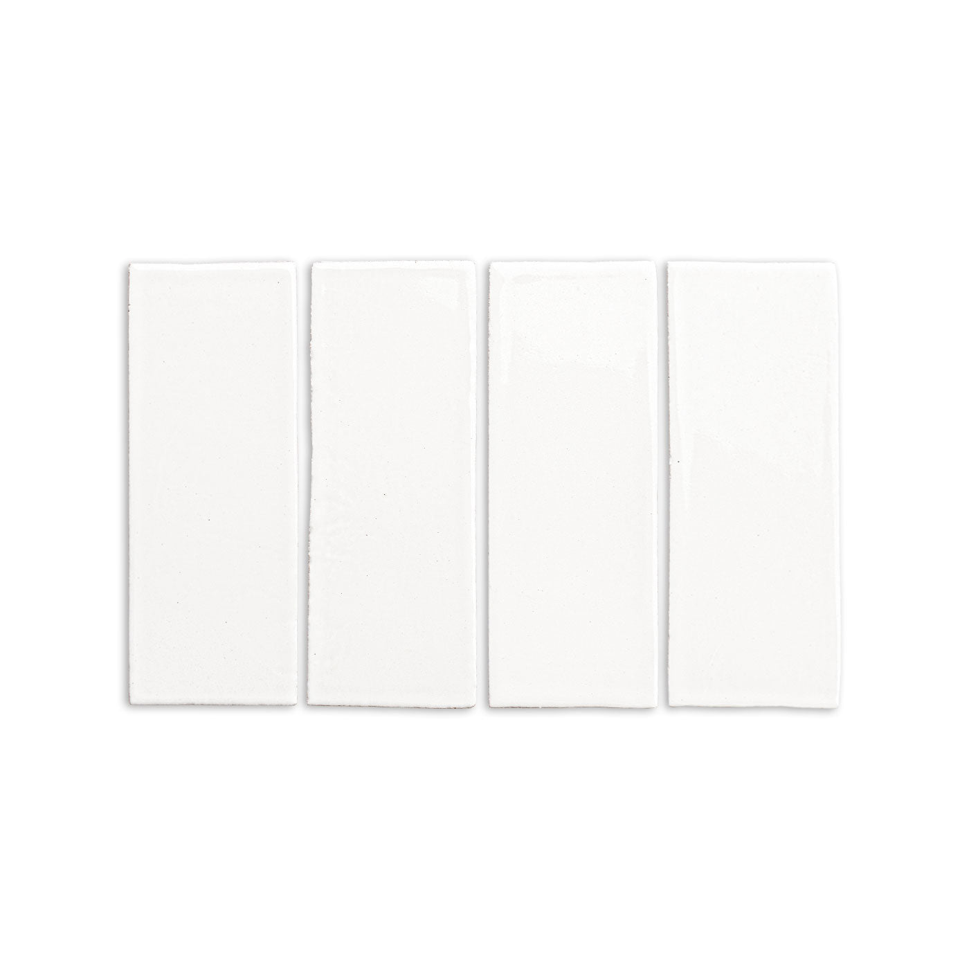 Four white 2x6 glossy tiles by Clay Imports, arranged horizontally with subtle texture on the edges.