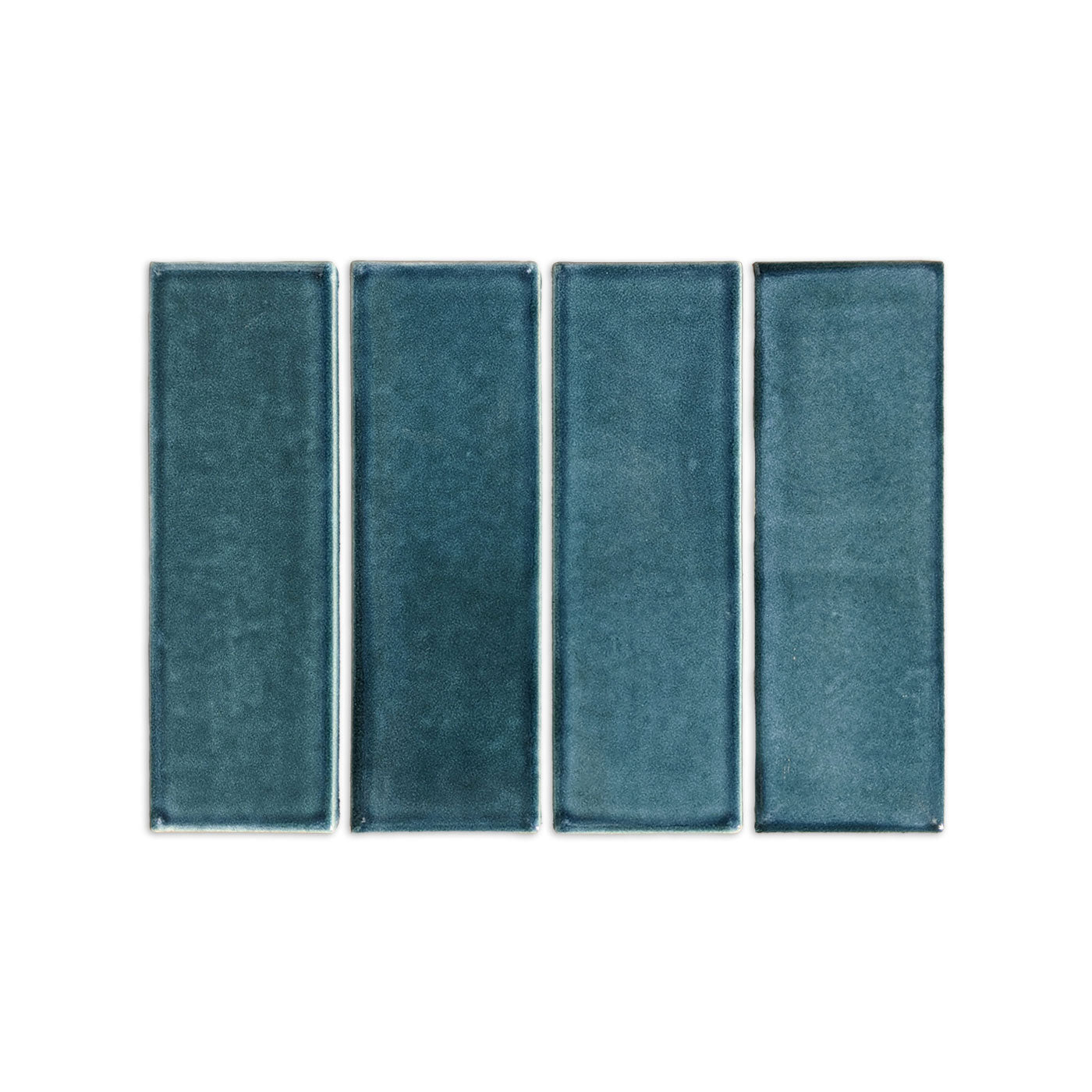 Botanical Teal subway tile trim with glazed edges by Clay Imports, showing four vertical rectangular tiles with subtle texture variations.