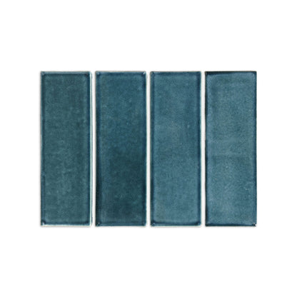 Botanical Teal subway tile trim with glazed edges by Clay Imports, showing four vertical rectangular tiles with subtle texture variations.