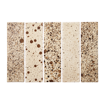 Five rectangular ceramic tiles with speckled terrazzo-style patterns in beige, brown, and cream, arranged side-by-side on a white background.