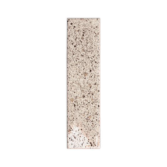 Pepper tile sample, light beige by Clay Imports, with dark speckled texture and straight edges.
