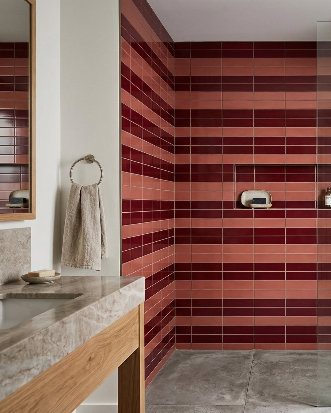 Plum 2x8 clay tiles by Clay Imports, arranged in alternating dark and light plum horizontal stripes on a shower wall.