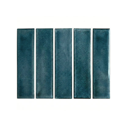 Botanical Teal 2x8 clay tiles by Clay Imports, showing five vertical pieces with a glazed texture.