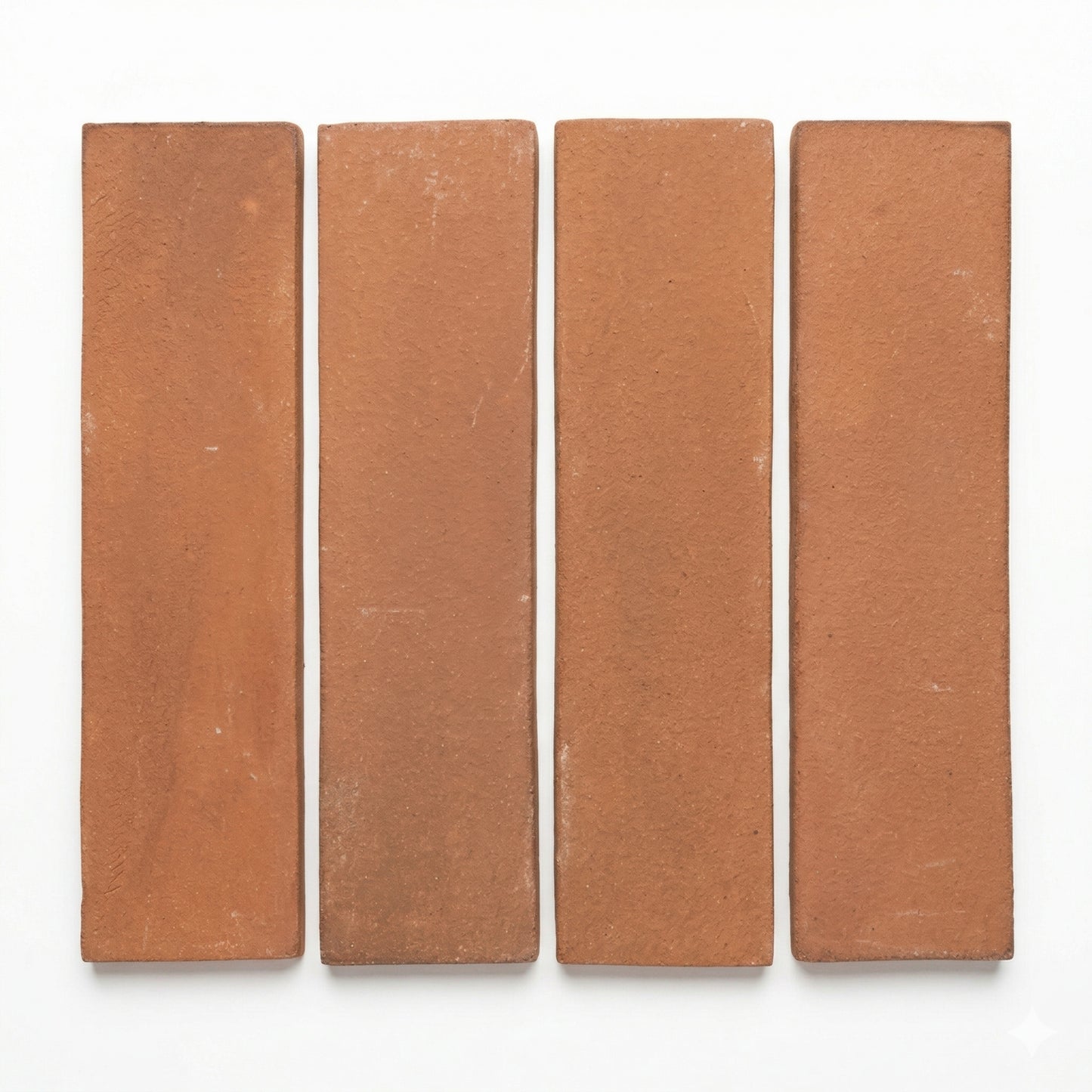 Four umber Cotto 2x8 tiles by Clay Imports, arranged vertically with white gaps, showcasing a matte, textured finish.