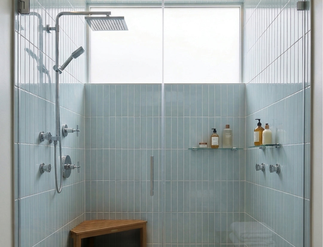 Glossy light blue solid tiles by Clay Imports, vertically installed in a modern shower with chrome fixtures.