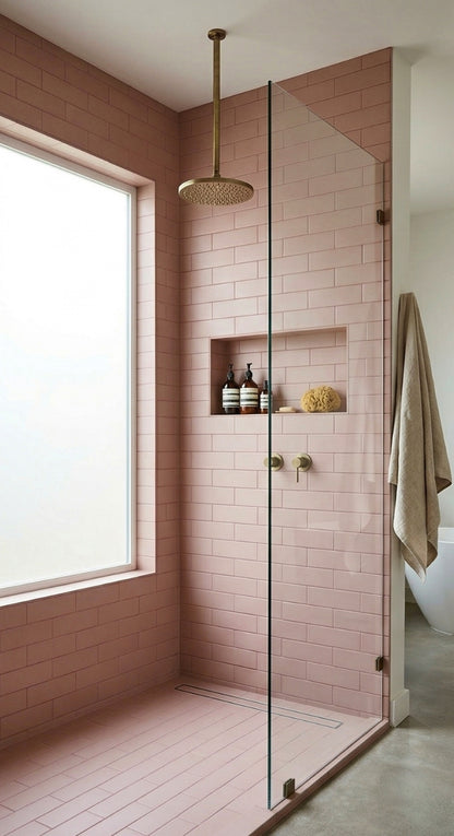 Rosewater matte 2x8 solid tile by Clay Imports covering shower walls and floor, with brass fixtures and a glass screen.