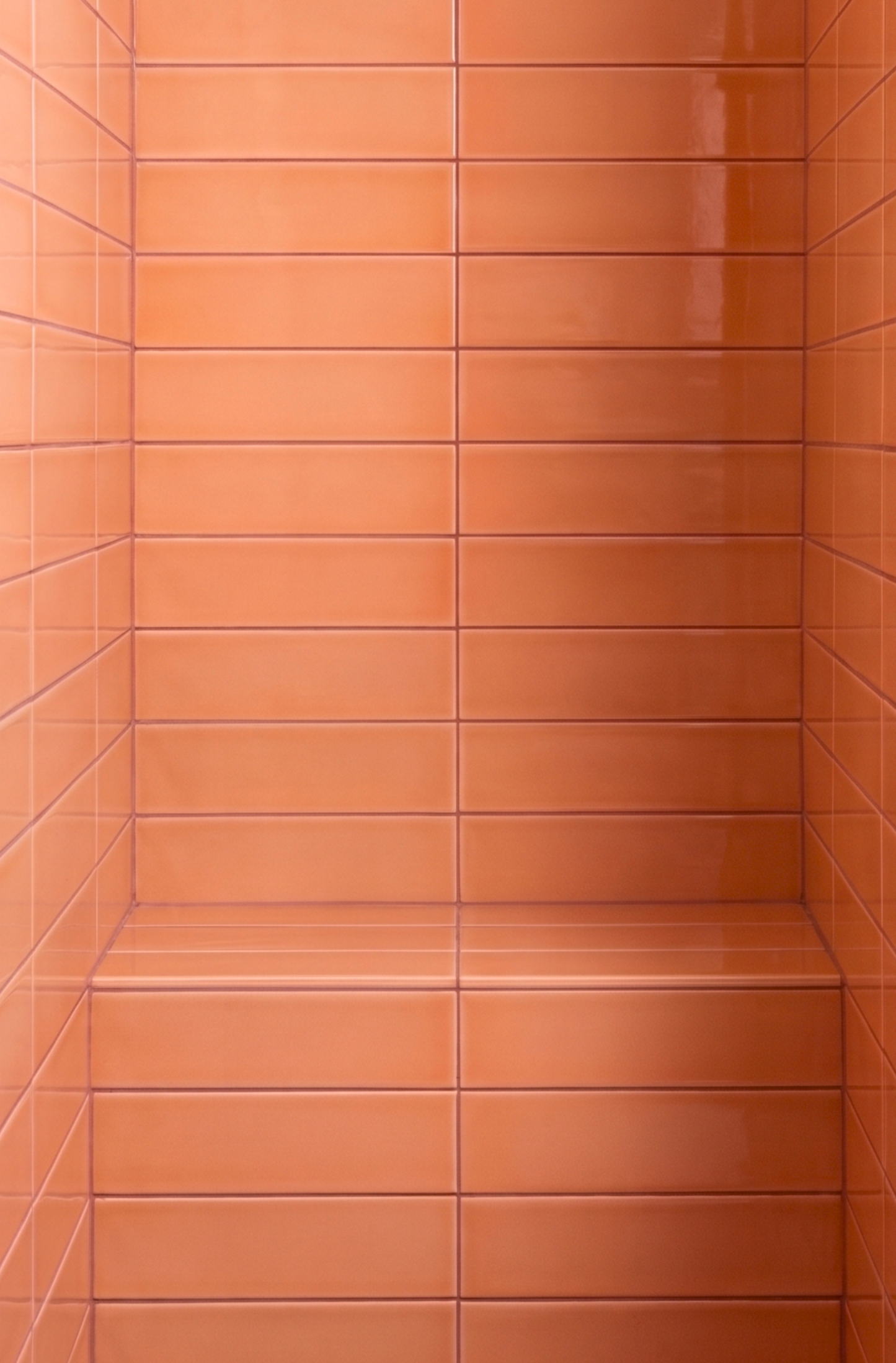 Tiled wall with horizontal orange tiles
