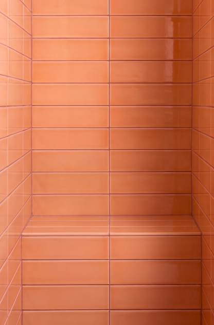 Tiled wall with horizontal orange tiles