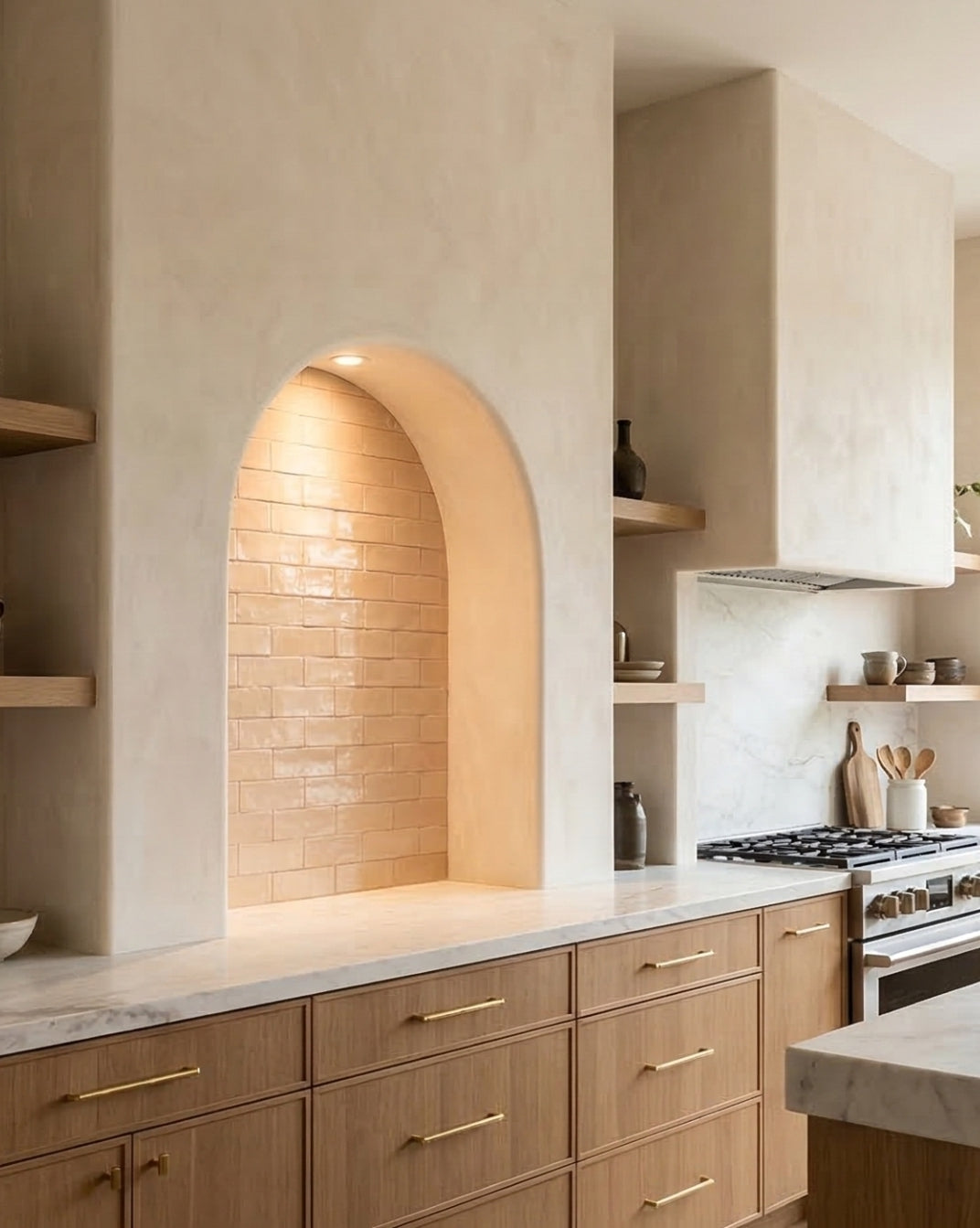 Apricot 2.5x8 Glazed Thin Brick by Clay Imports, used as a back wall in a light-filled arched kitchen alcove.