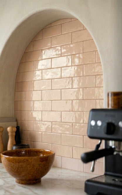 Apricot Glazed Thin Brick from Clay Imports with a glossy finish, installed in an arched kitchen alcove.