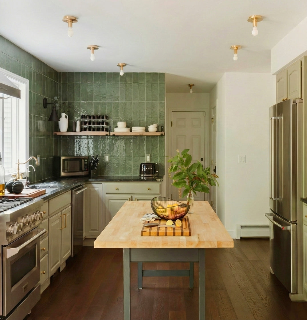 Glazed thin brick in moss green by Clay Imports, forming a textured kitchen backsplash with open shelving.