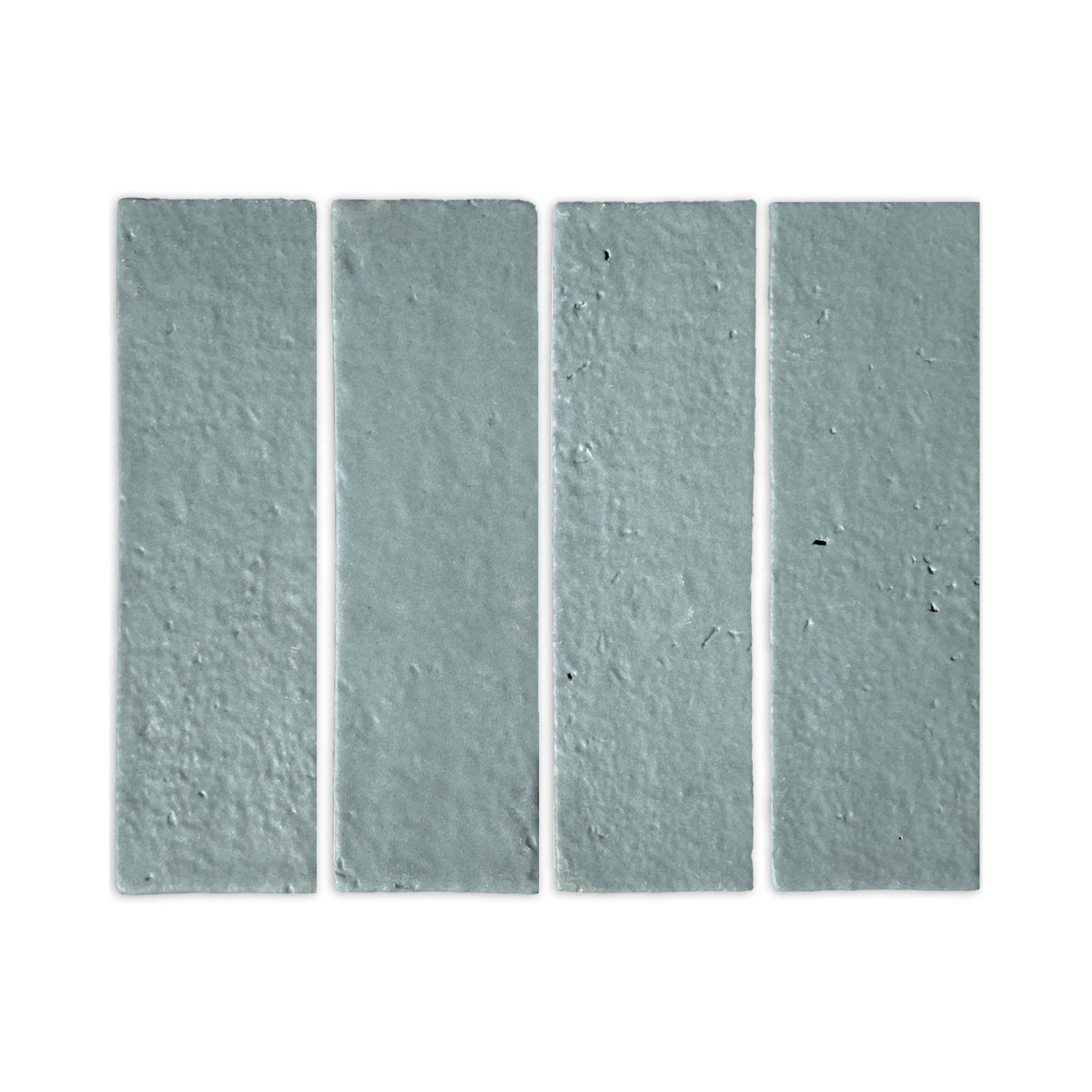 Rucksack Green Glazed Thin Brick 2.5x8 by Clay Imports, four vertically arranged textured tiles.
