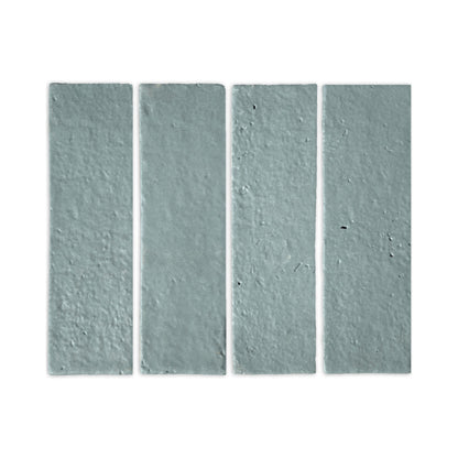 Rucksack Green Glazed Thin Brick 2.5x8 by Clay Imports, four vertically arranged textured tiles.