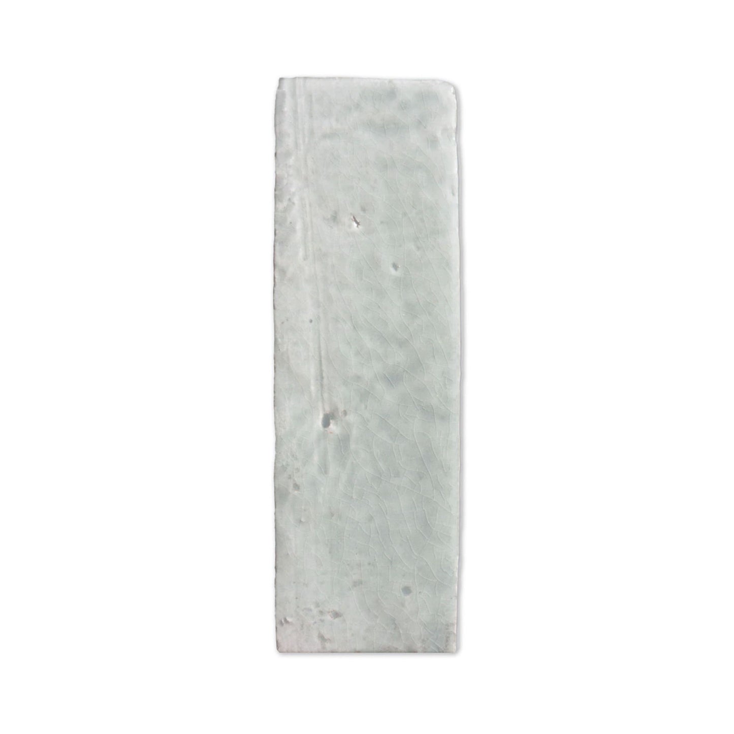 Glazed thin brick in Glacier by Clay Imports, a rectangular tile with subtle crackle texture and irregular edges.