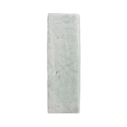 Glazed thin brick in Glacier by Clay Imports, a rectangular tile with subtle crackle texture and irregular edges.