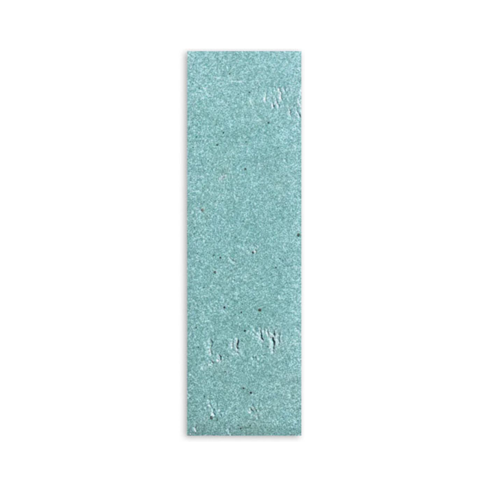 Light green 2.5x8 glazed thin brick sample by Clay Imports with a subtly textured, speckled surface and uneven finish.