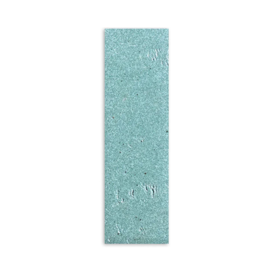 Light green 2.5x8 glazed thin brick sample by Clay Imports with a subtly textured, speckled surface and uneven finish.