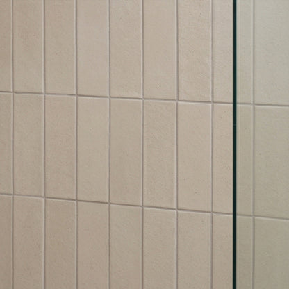 Light beige rectangular solid tile by Clay Imports with a subtle grainy texture and vertical orientation.