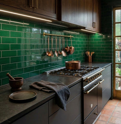 Green glossy solid tile by Clay Imports in a subway pattern on a kitchen backsplash.