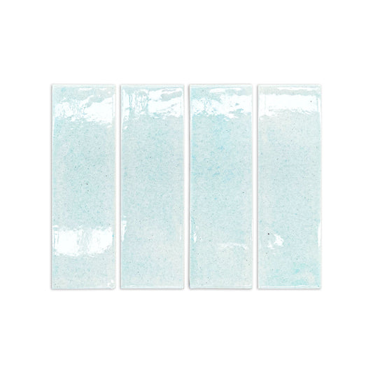 Light blue crackle-glazed rectangular clay tiles with speckled texture and glossy finish, arranged in a row, front view