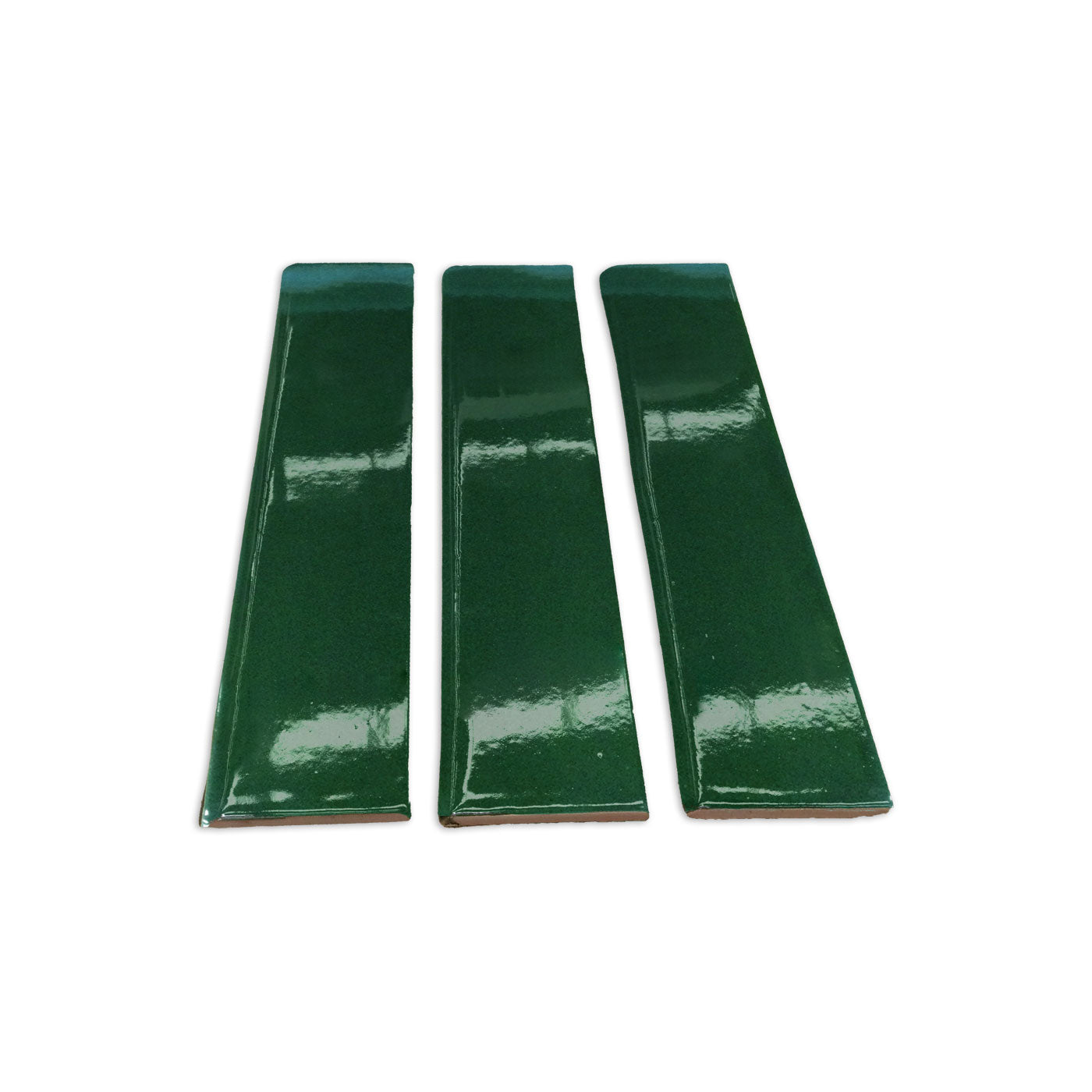 Three glossy Bottle Green 3x12 clay tiles by Clay Imports, arranged side-by-side with visible reddish-brown unglazed edges.