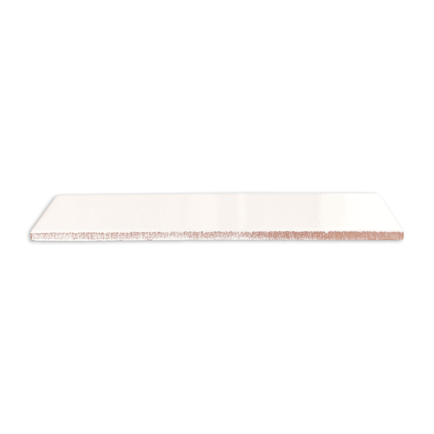 White clay Candela 3x12 tile by Clay Imports, featuring a glossy top and rough, reddish-brown edges from the side.