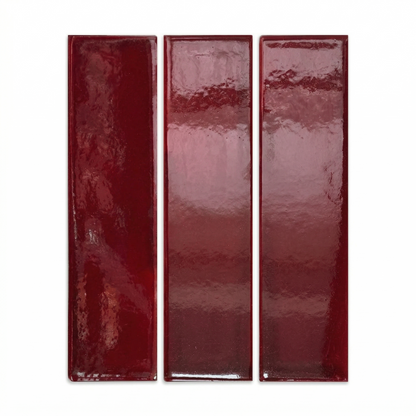 Three glossy oxblood red clay tiles by Clay Imports, showing subtle surface texture.