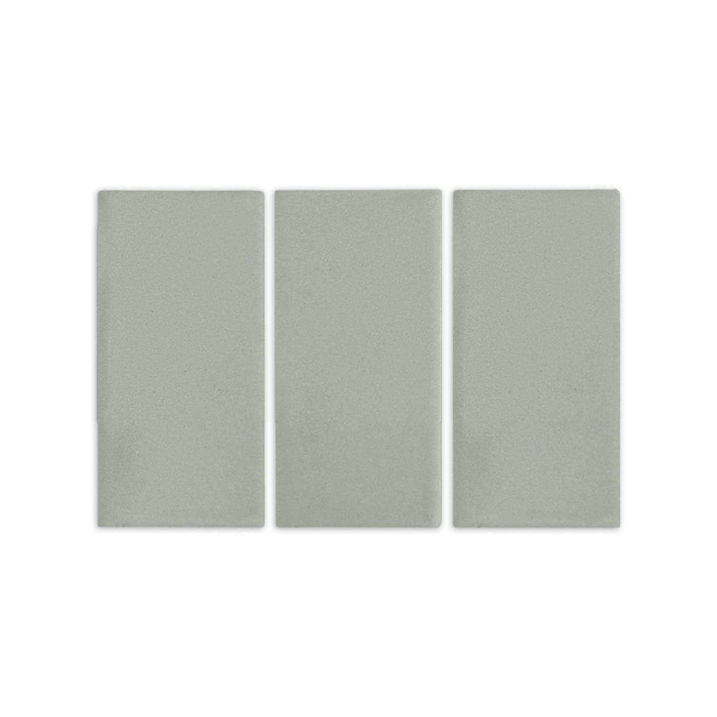Agave clay tiles by Clay Imports, three light green rectangular pieces with a subtle, speckled texture.
