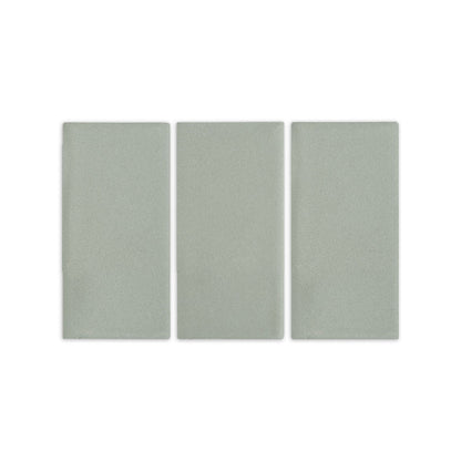Agave clay tiles by Clay Imports, three light green rectangular pieces with a subtle, speckled texture.