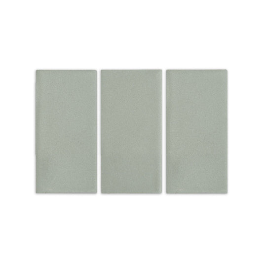 Agave clay tiles by Clay Imports, three light green rectangular pieces with a subtle, speckled texture.