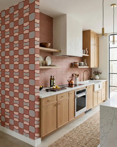 Pink Granite 3x6 clay tiles by Clay Imports, installed as a kitchen backsplash with light wood cabinets and open shelving.