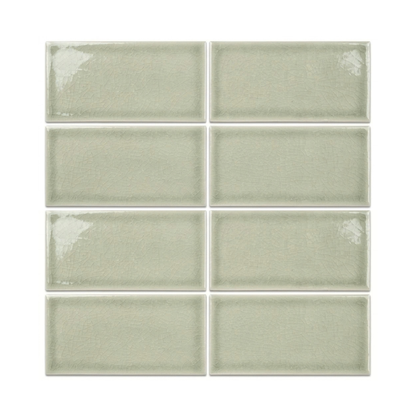 Six rectangular glossy ceramic subway tiles in a pale sage green color, arranged in a two-column grid on a white background.