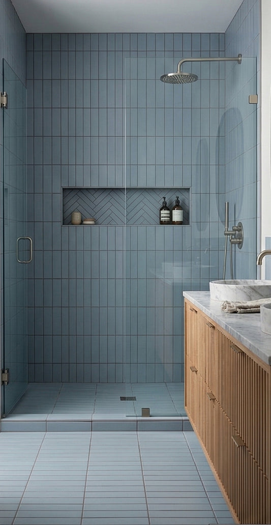 Blue-gray 3x12 clay tile from Clay Imports, with vertical and herringbone patterns in a modern shower.