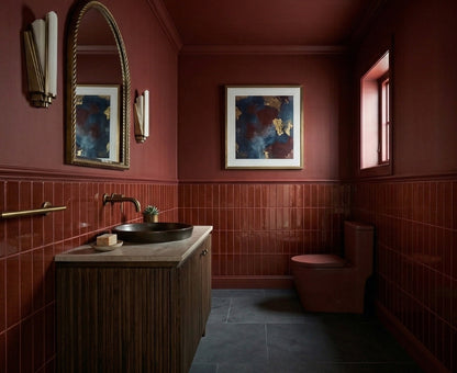 Americano 3x12 reddish-brown solid tile by Clay Imports, glossy, arranged vertically in a luxurious bathroom.
