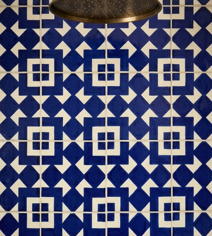Blue and white Traditional Talavera tile by Clay Imports Handmade Tile, featuring a geometric pattern of interlocking blue diamonds and white squares.
