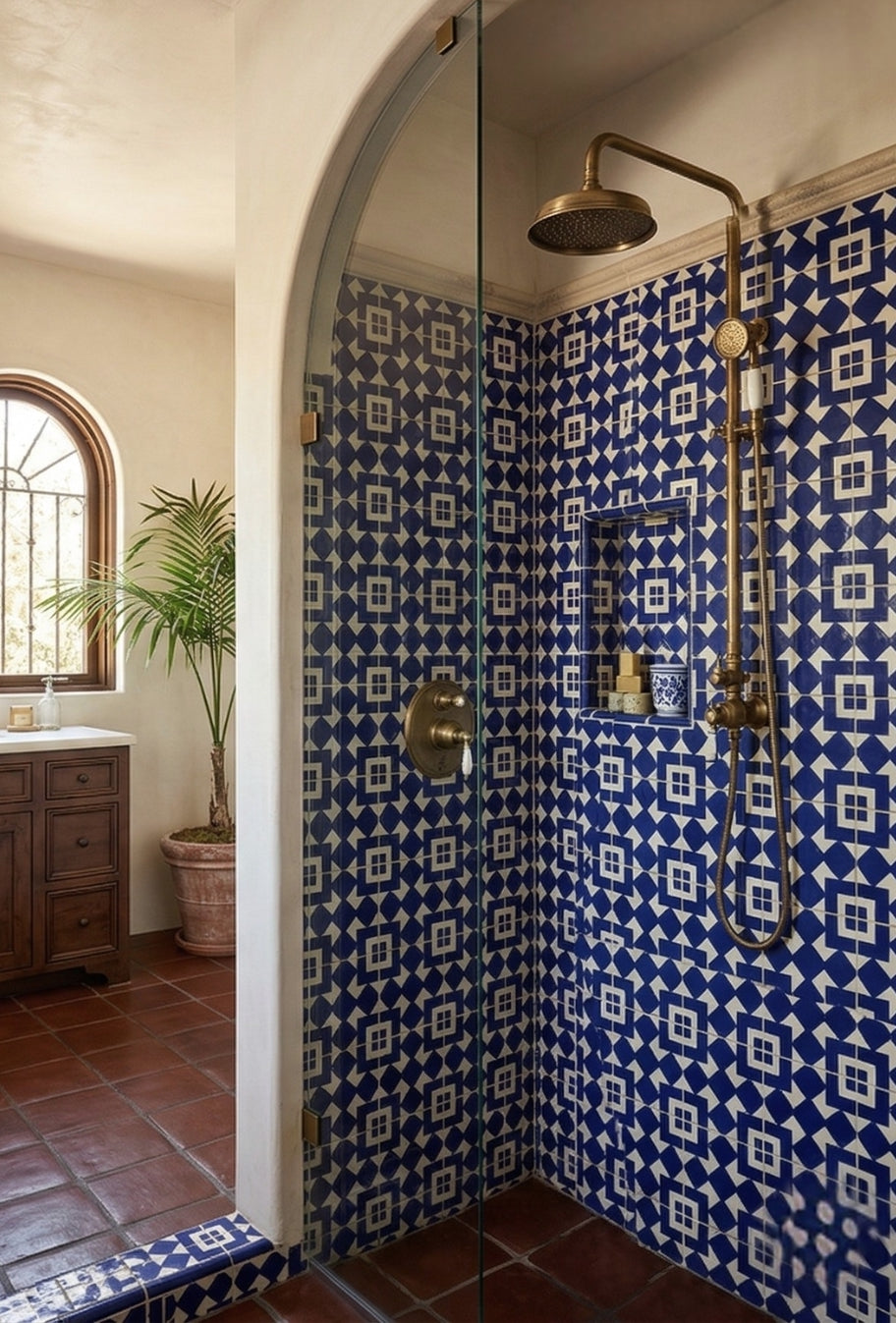 Blue and white Talavera tile by Clay Imports Handmade Tile with a geometric Santiago pattern on a shower wall.