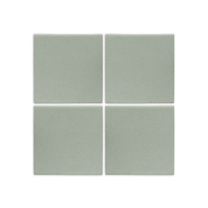 Four square agave green clay tiles by Clay Imports with a subtle textured, matte finish.