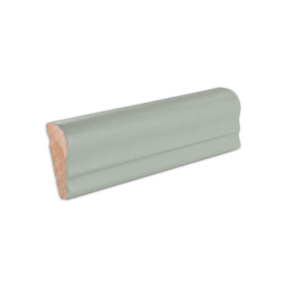 Agave green and terracotta chair rail trim by Clay Imports, with a ridged green top and rustic clay base.