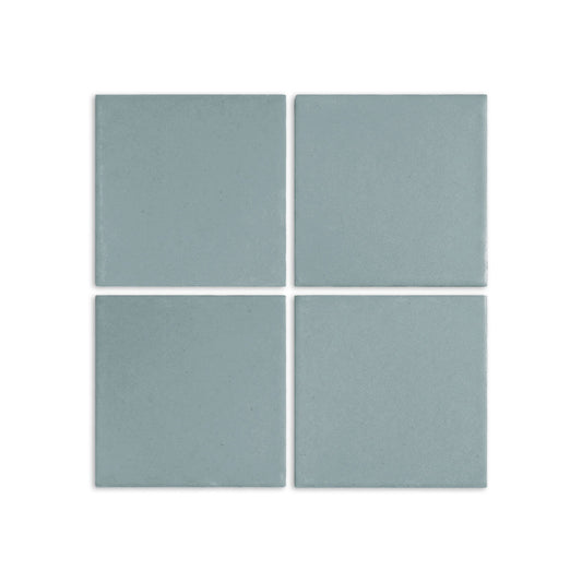 Pale teal square clay tiles by Clay Imports with a matte speckled texture, arranged in a 2x2 grid.