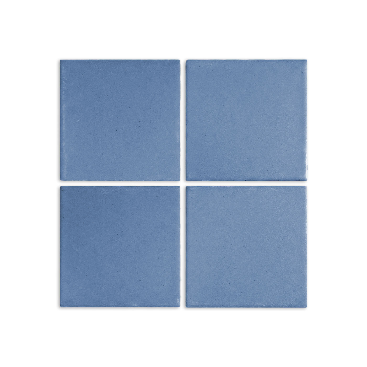 Four denim blue clay tiles by Clay Imports, arranged in a square with a textured matte finish.