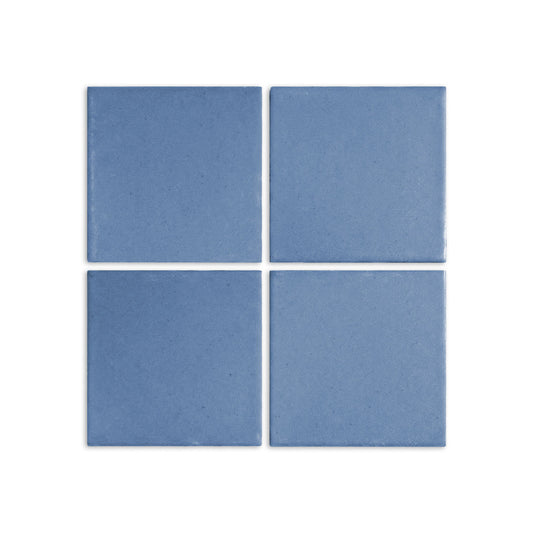 Four denim blue clay tiles by Clay Imports, arranged in a square with a textured matte finish.