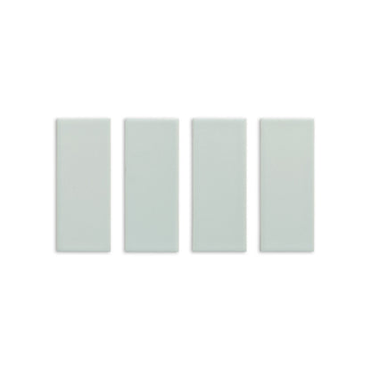 Four Espadin Matte 2x5 solid tiles by Clay Imports in light green with a subtle texture, arranged vertically.