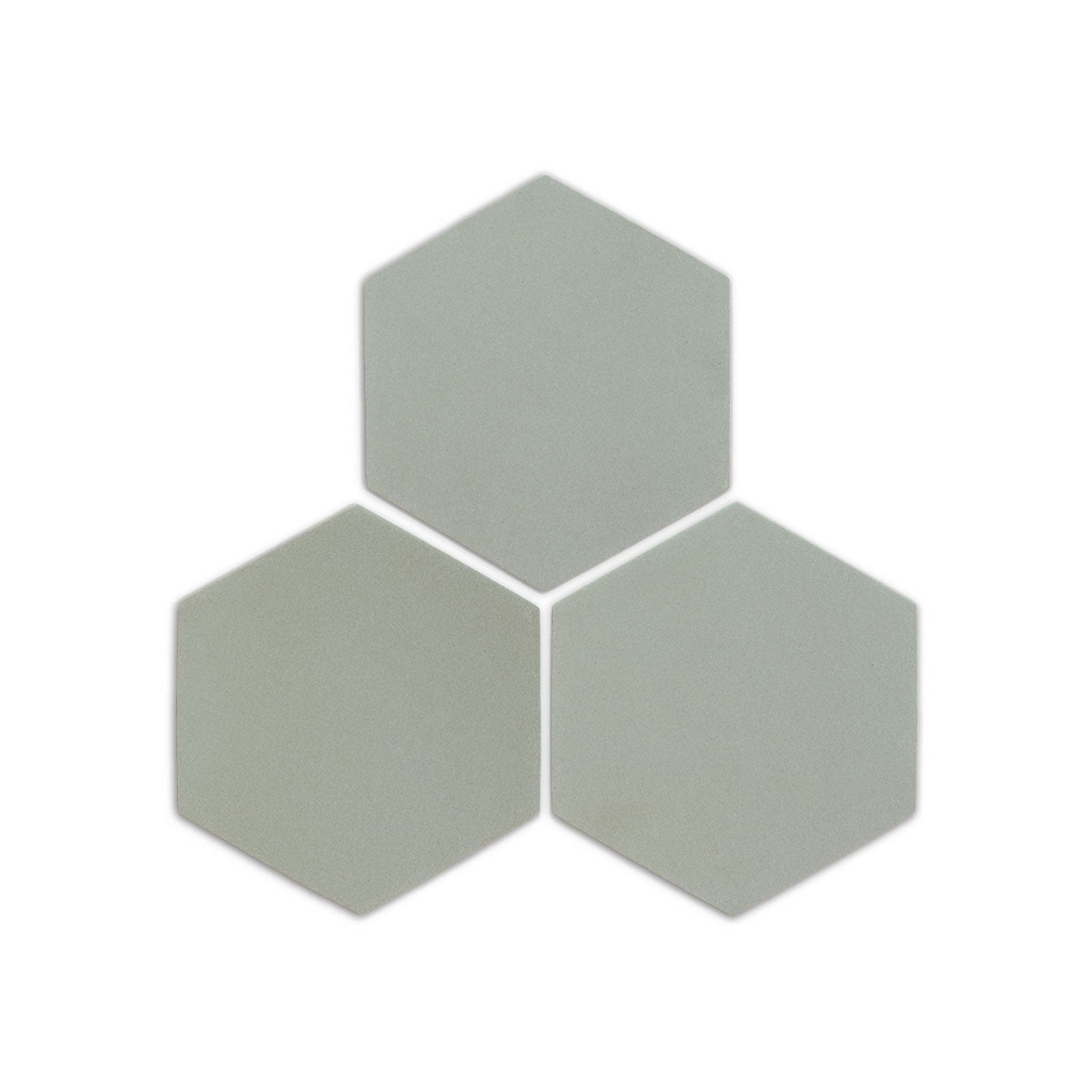Three light green hexagon clay tiles by Clay Imports, arranged in a cluster with a matte finish.