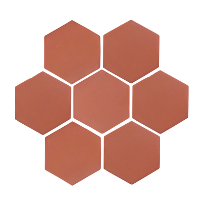 Earthen red Barro hexagon tile by Clay Imports, arranged in a seven-tile cluster with white grout lines.