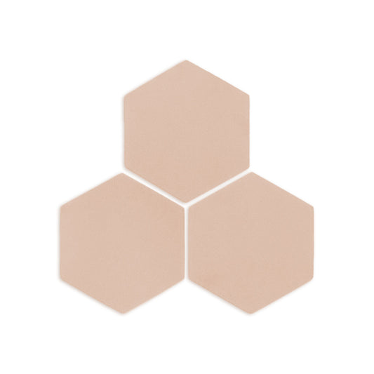 Three textured hexagon sand-colored clay tiles by Clay Imports, arranged in a triangular pattern.