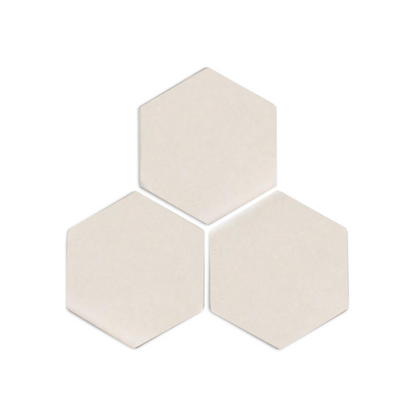Light beige hexagonal clay tiles by Clay Imports, arranged in a cluster on a white background with soft shadows.