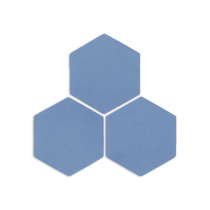Denim blue hexagonal clay tiles by Clay Imports, arranged in a cluster with a subtle texture.
