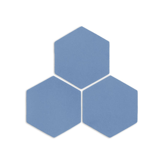 Denim blue hexagonal clay tiles by Clay Imports, arranged in a cluster with a subtle texture.